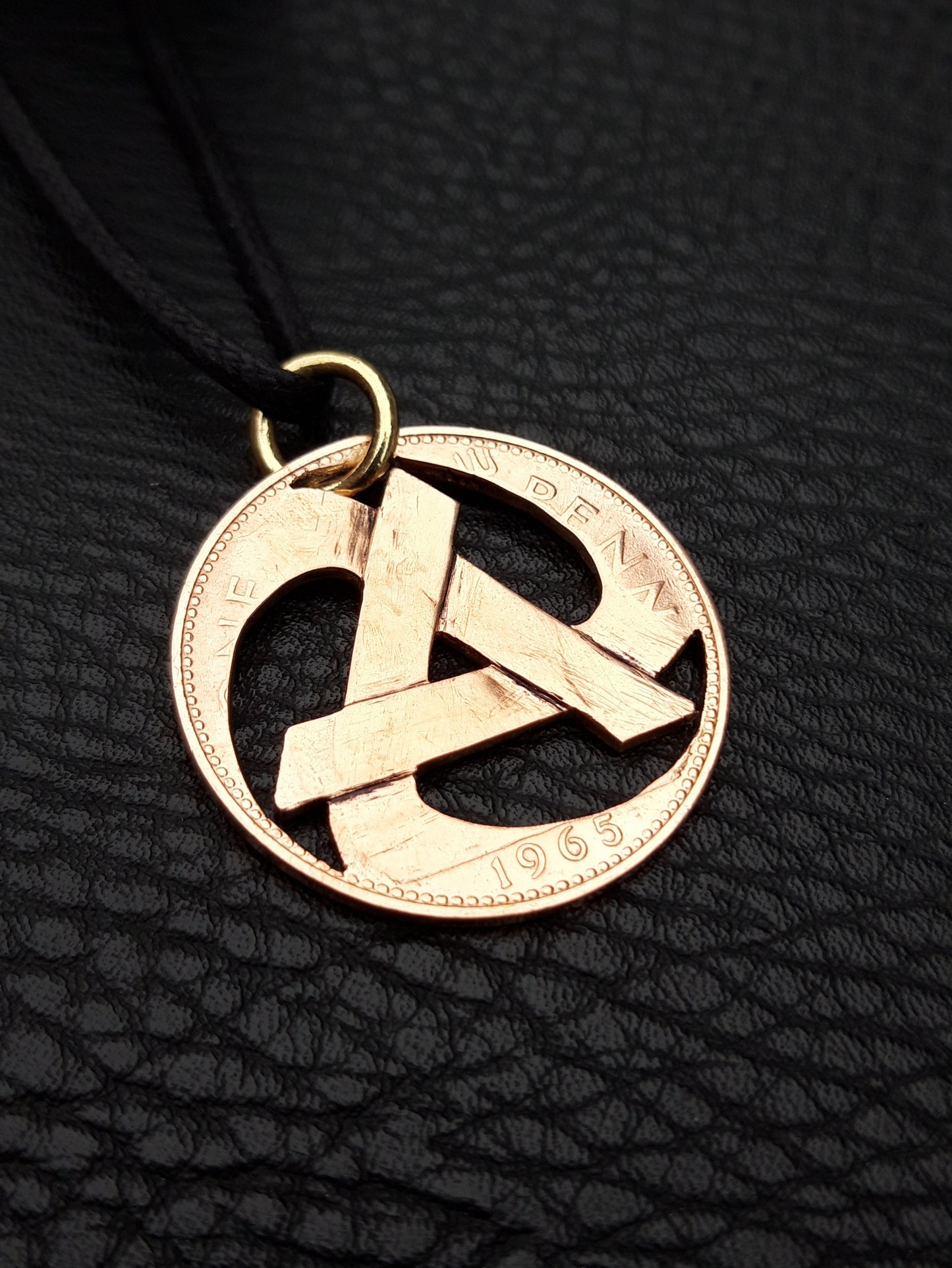 Rolling anarchy symbol pendant